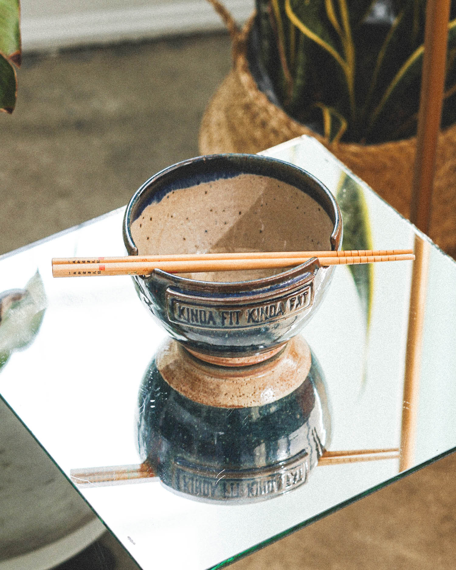 red clay ramen bowl made for ramen noodles with a chopstick holder