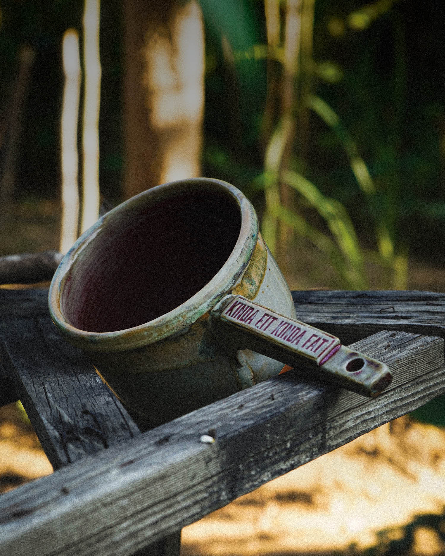 clay ceramic tabo bowl on wood branches in work bench