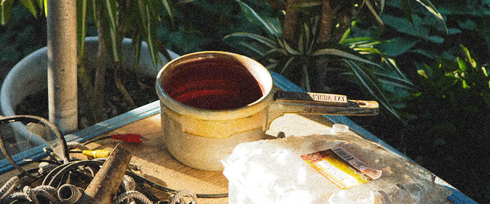 clay ceramic tabo bowl on wood branches in work bench